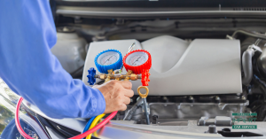 car technician evaluating the AC of a car